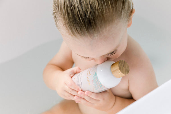 Baby in bath with Kind Coconuts natural baby bath oil